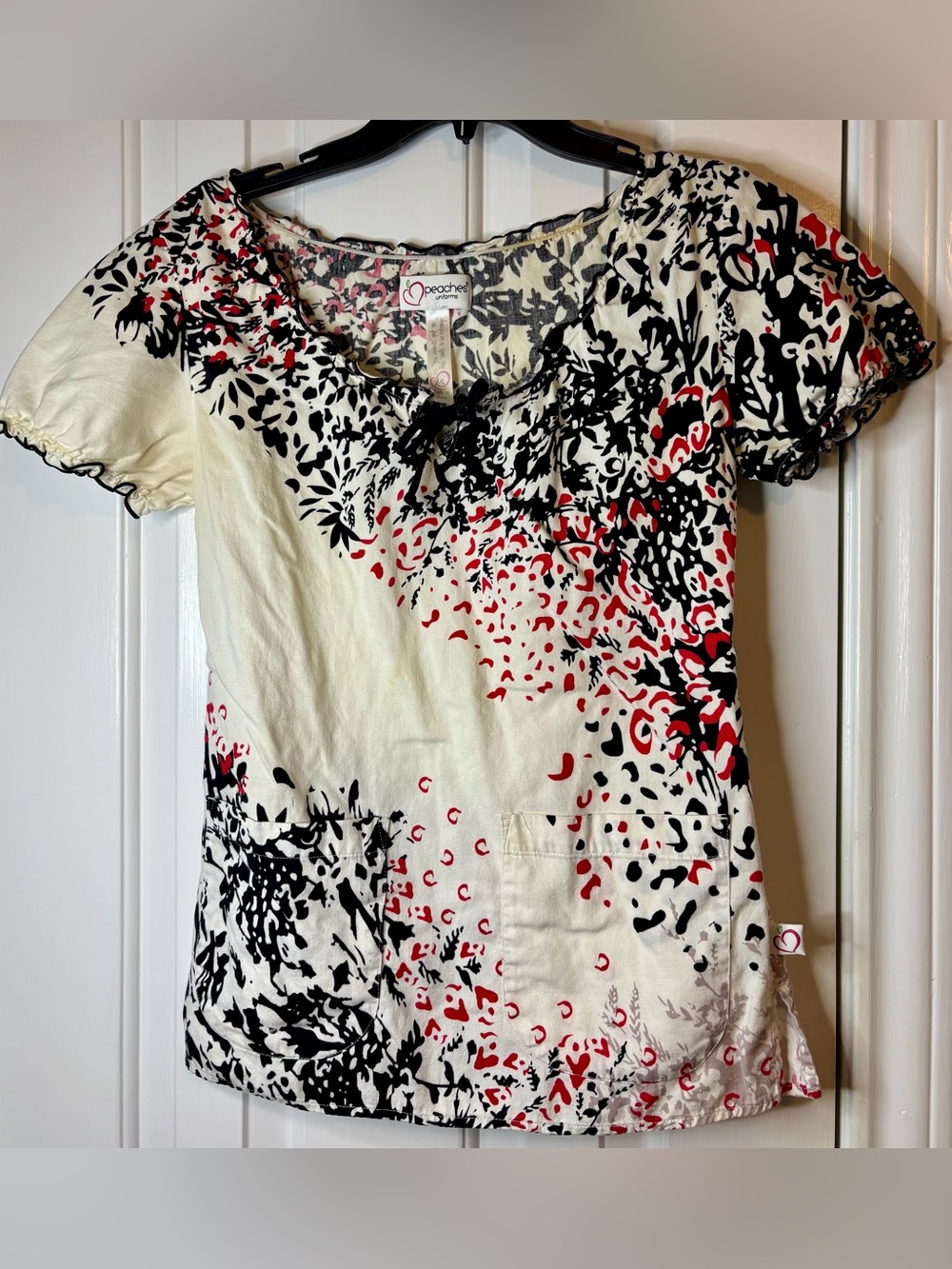 Peaches Uniforms Cream Scrub top with Black & Red Abstract Floral Print